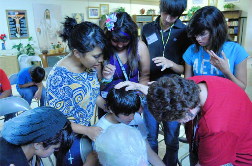 Prayer group with teens
